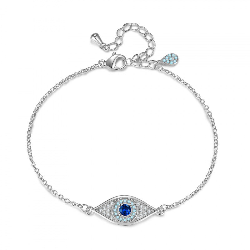 Silver tone blue crystal evil eye bracelet with adjustable extender