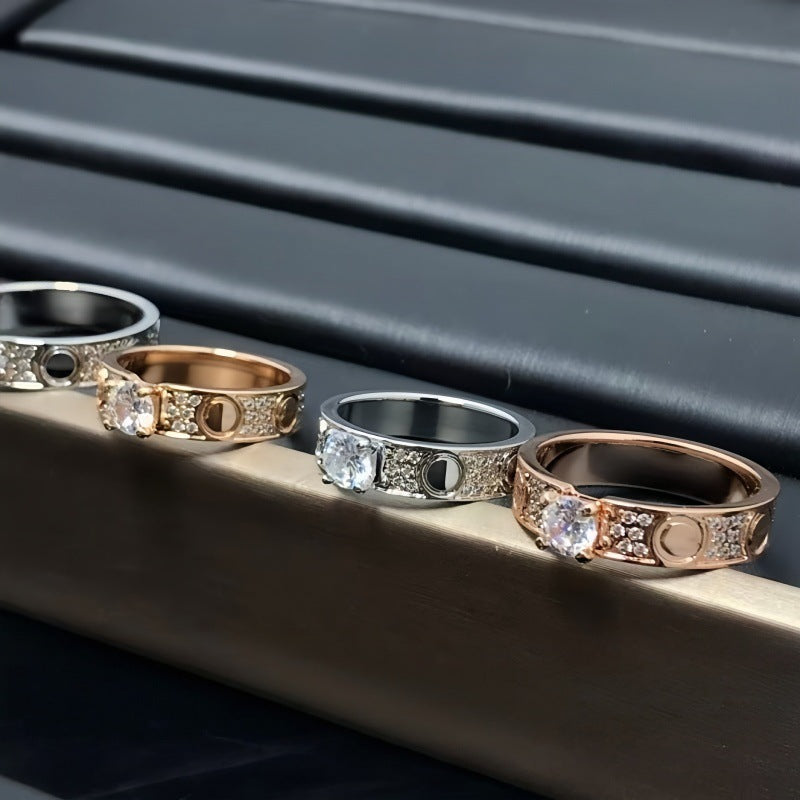 Raised solitaire circle-motif ring collection on a display rail - photo 33