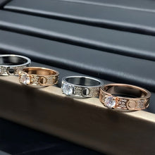 Raised solitaire circle-motif ring collection on a display rail - photo 33