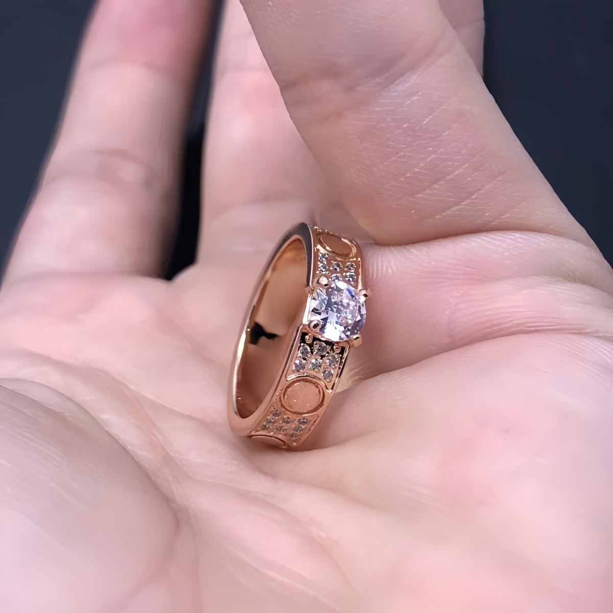 Rose-gold-tone raised solitaire ring on a display cushion - photo 10