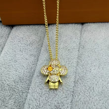 Gold Tone pave flower doll pendant necklace with a smiley photo overlay - photo 04
