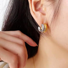 Two tone layered C-hoop stud earrings styled on ear