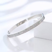 Silver tone two-row cubic zirconia screw motif bangle