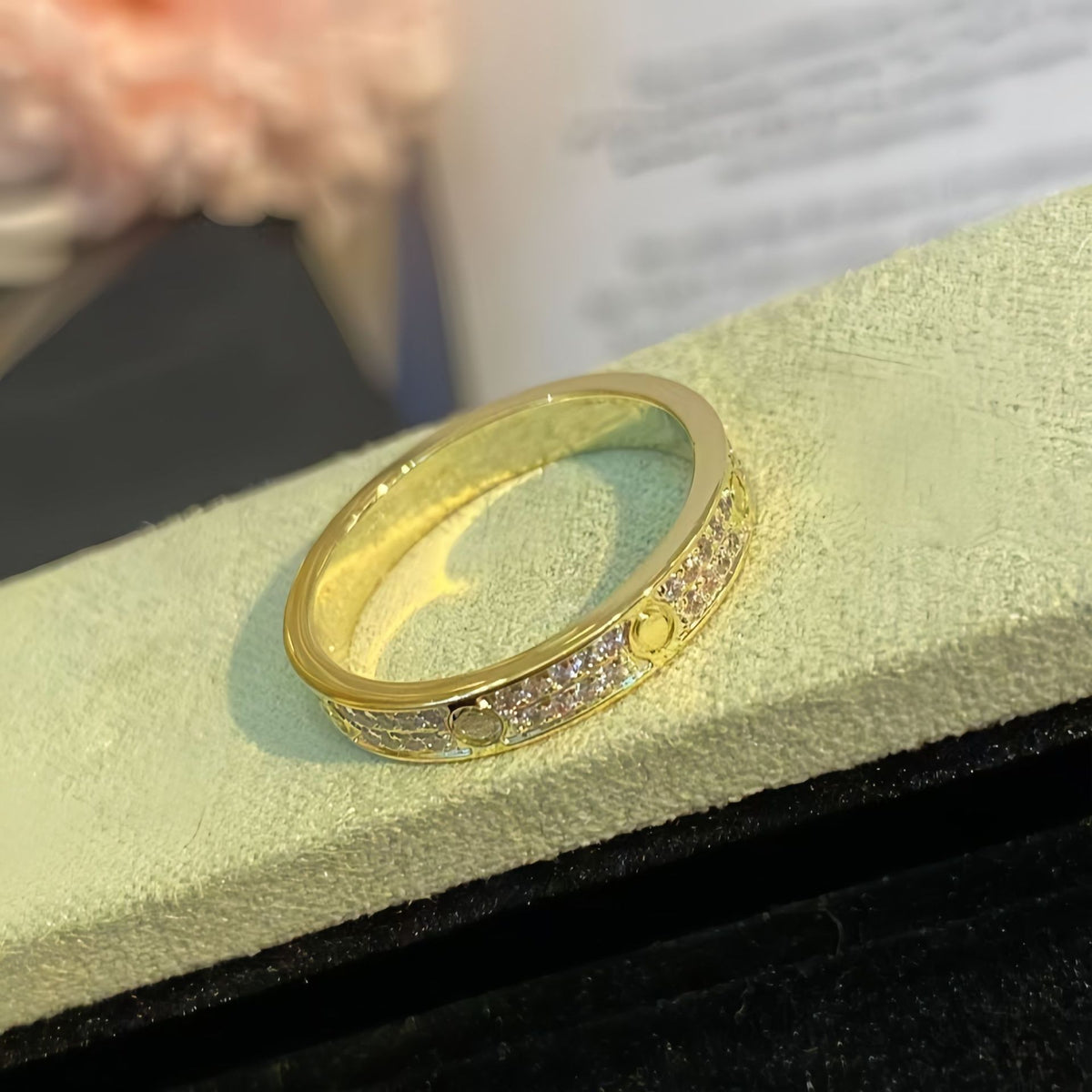 Gold-tone two-row pave circle-motif band ring on a cushion - photo 37
