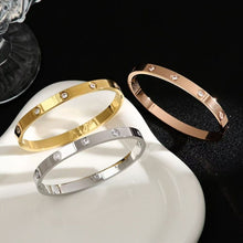 Gold, silver and rose gold tone cubic zirconia hinged bangles