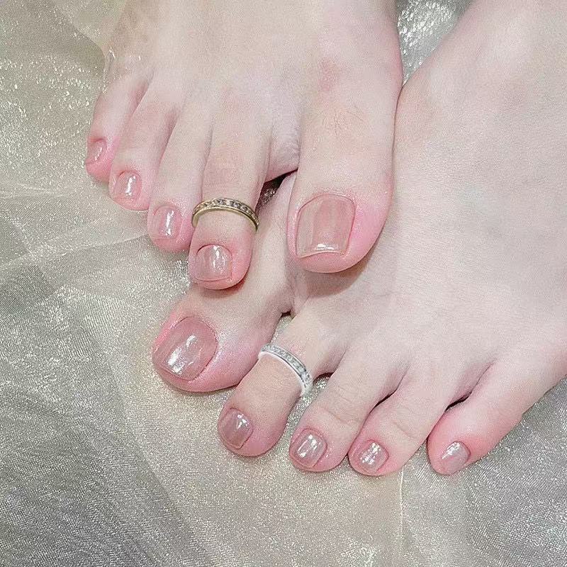 Gold and silver adjustable cubic zirconia toe rings worn on feet