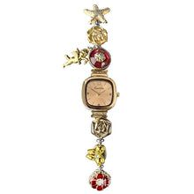 Supplier reference of Caramel Khaki rounded-square watch with starfish, sculpted roses, cherub and butterfly charms