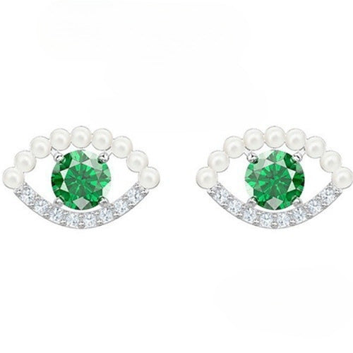Green crystal and pearl evil eye stud earrings in silver tone