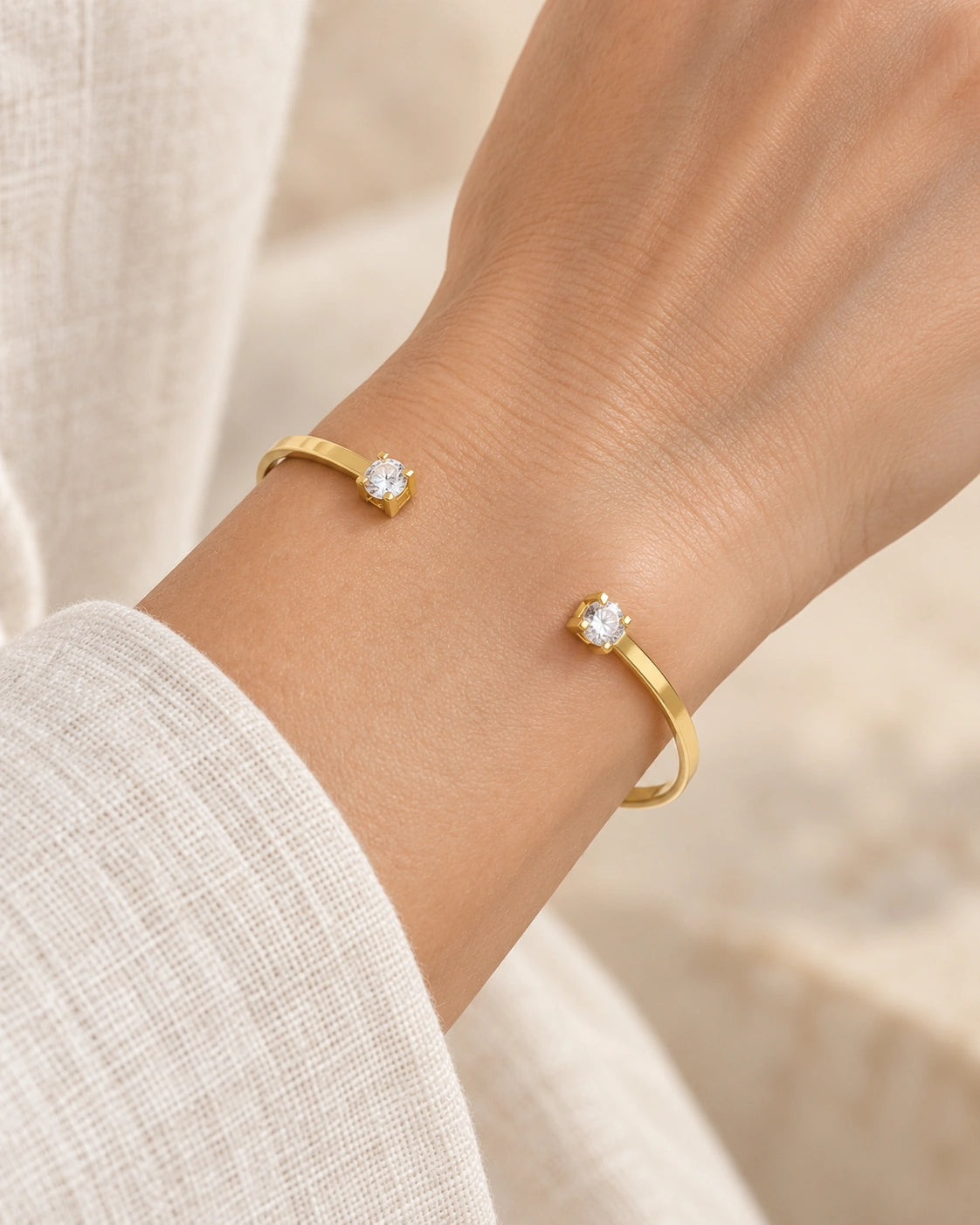 Double-Stone Open Bangle Bracelet worn on an adult model
