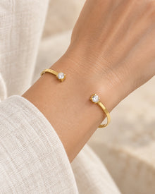 Double-Stone Open Bangle Bracelet worn on an adult model