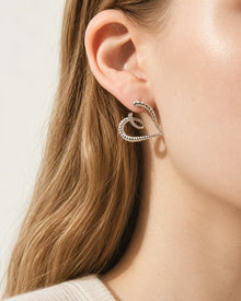 Spiral Heart Stud Earrings worn on an adult model