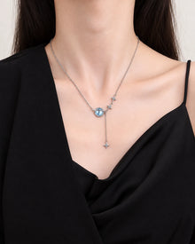 Planet Pendant Lariat Necklace worn on an adult model
