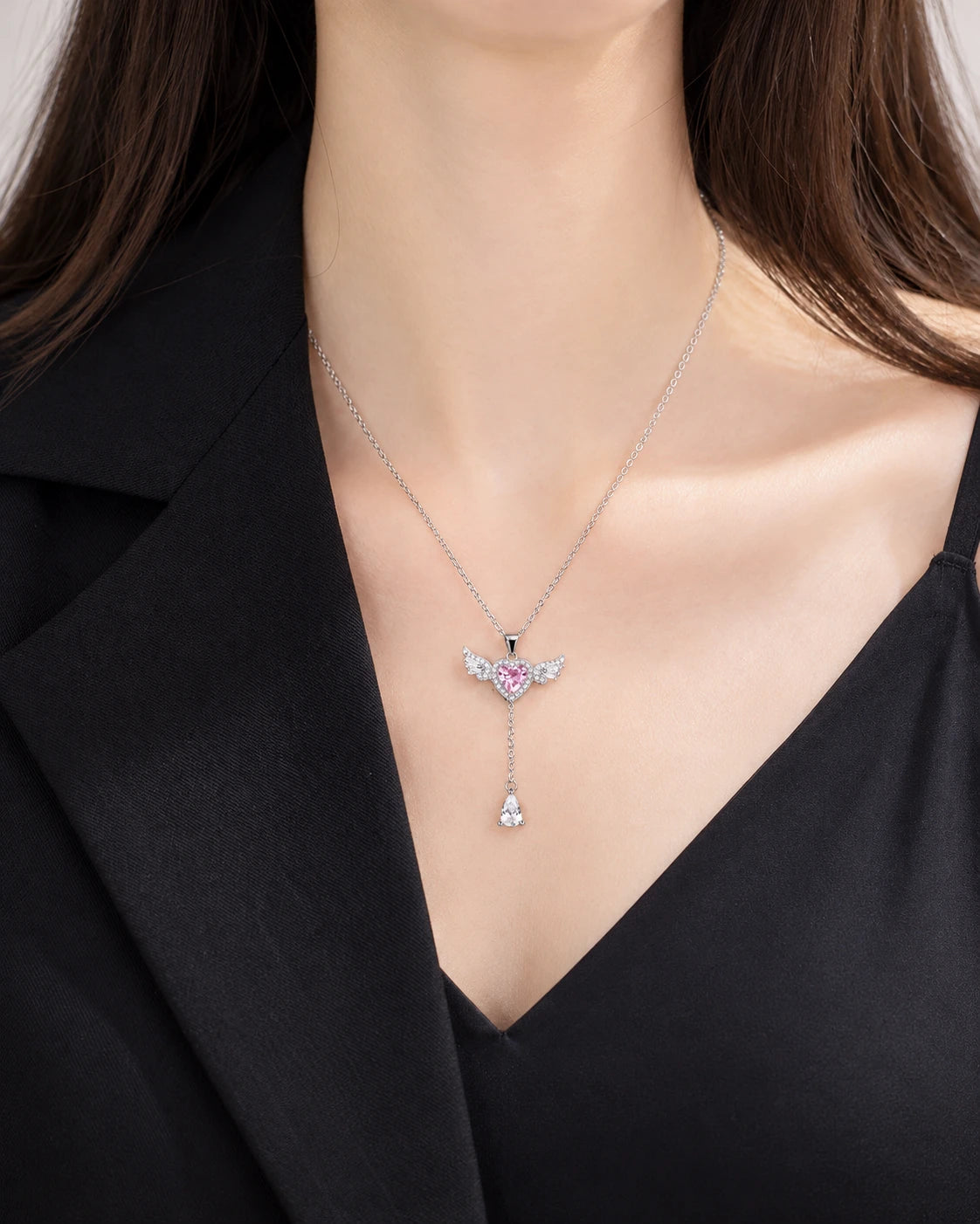 Pink Heart and Wing Lariat Necklace worn on an adult model