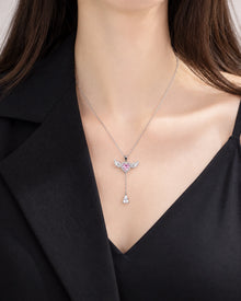 Pink Heart and Wing Lariat Necklace worn on an adult model