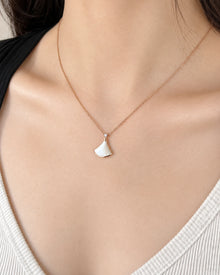 Fan-Shaped Shell & Crystal Pendant Necklace worn on an adult model