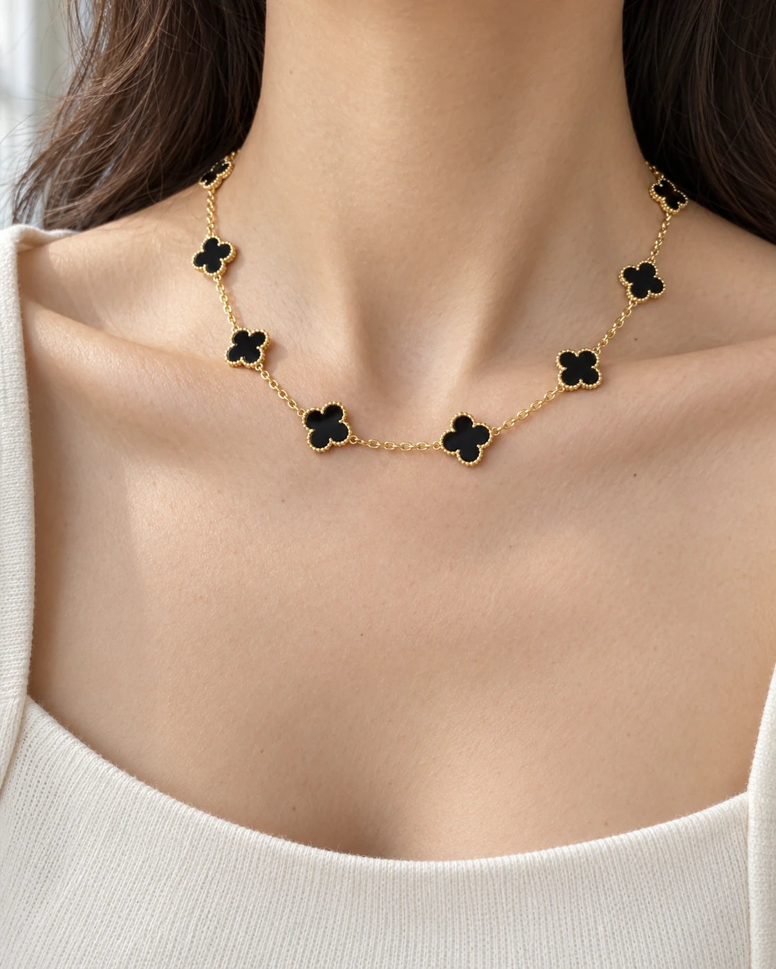 Ten-flower four-leaf clover necklace worn on an adult model