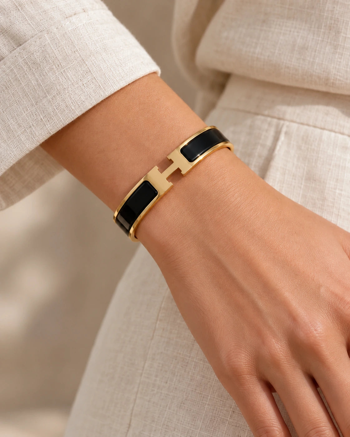 H Signature Bangle | Waterproof & Tarnish-Free worn on wrist with H-shaped clasp