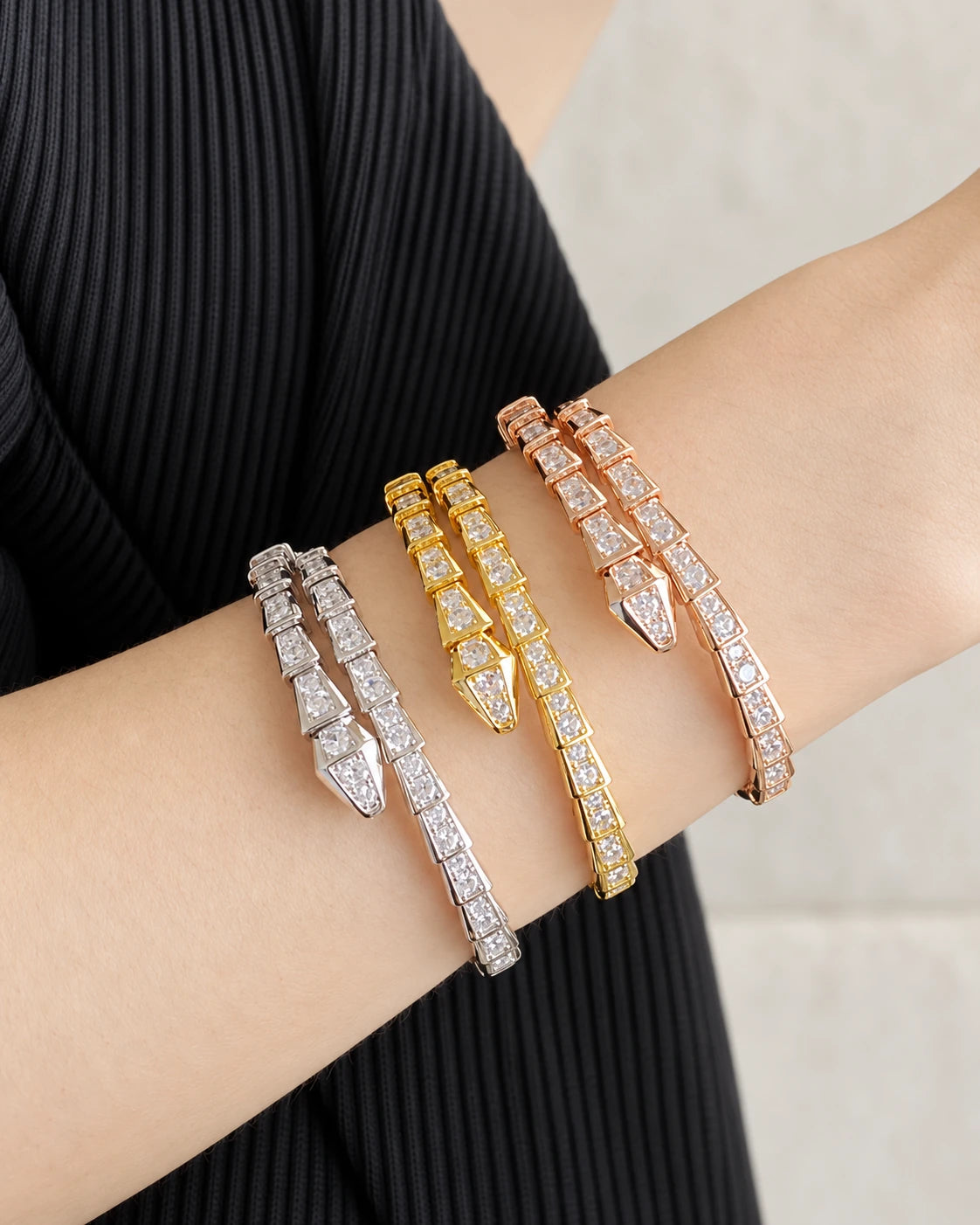 Serpent Aura Snake Wrap Bangle – Polished & Zircon-Set Styles worn on an adult model