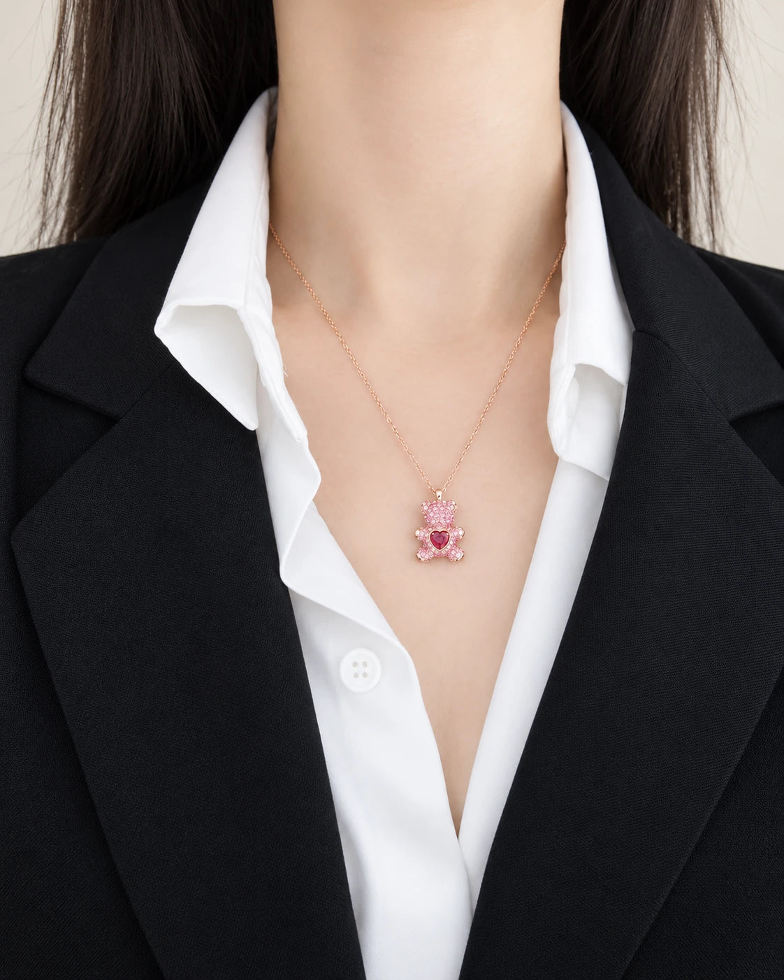 Beating Heart Teddy Bear Crystal Pendant Necklace worn on an adult model