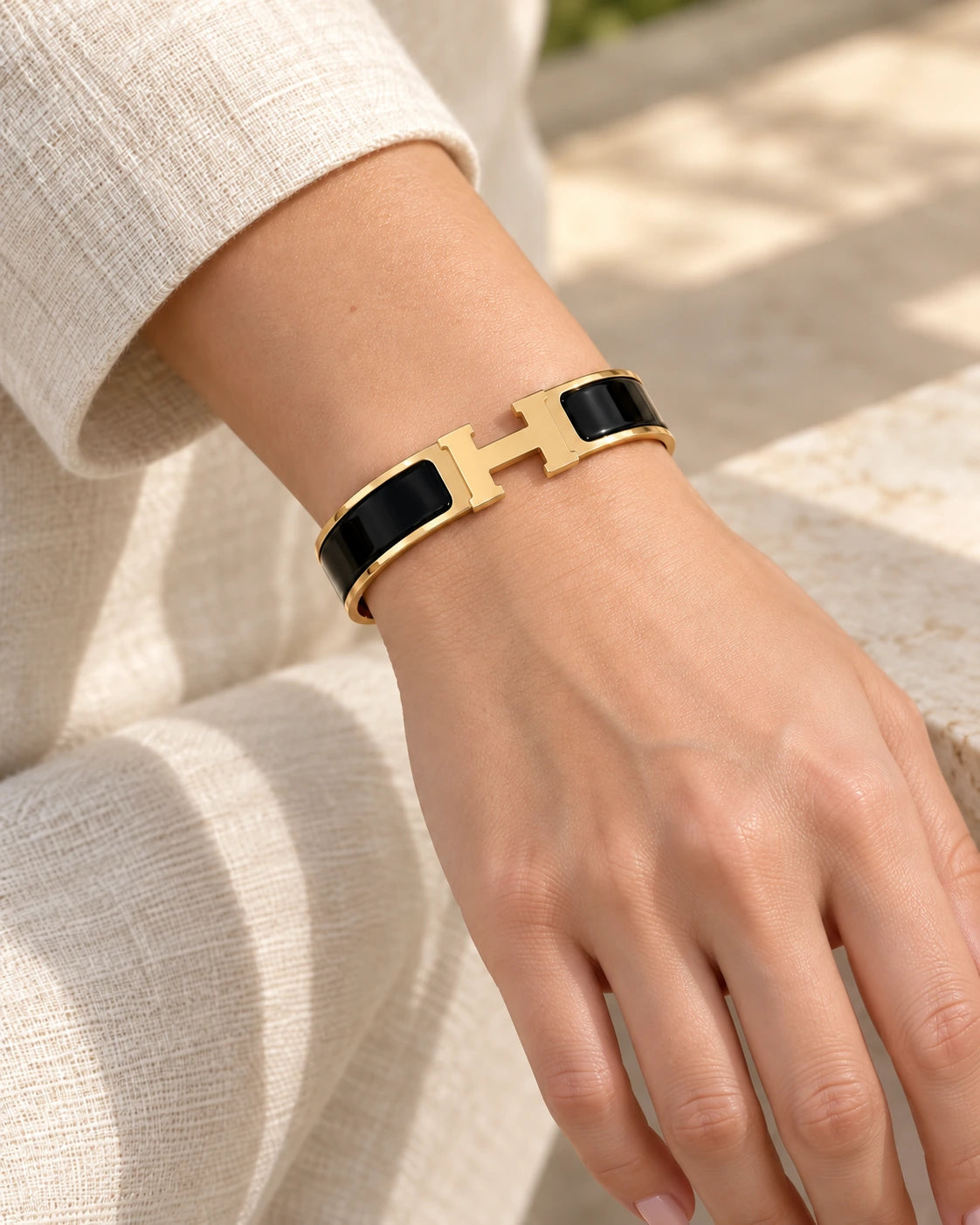 Signature H-Clasp Bangle – Minimalist & Secure Lock Bracelet, Everyday Luxury（Gold / Black） worn on wrist with H-shaped clasp
