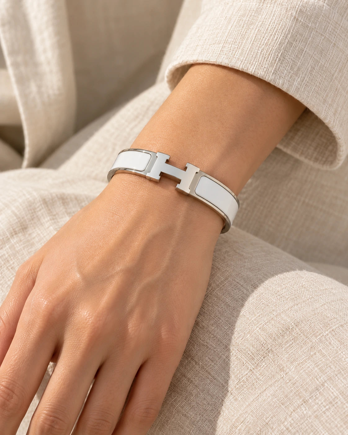 Signature H-Clasp Bangle – Minimalist & Secure Lock Bracelet, Everyday Luxury (Silver / White) worn on wrist with H-shaped clasp