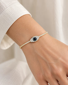 Blue Evil Eye Bangle Bracelet – Gold Tone – model wearing view