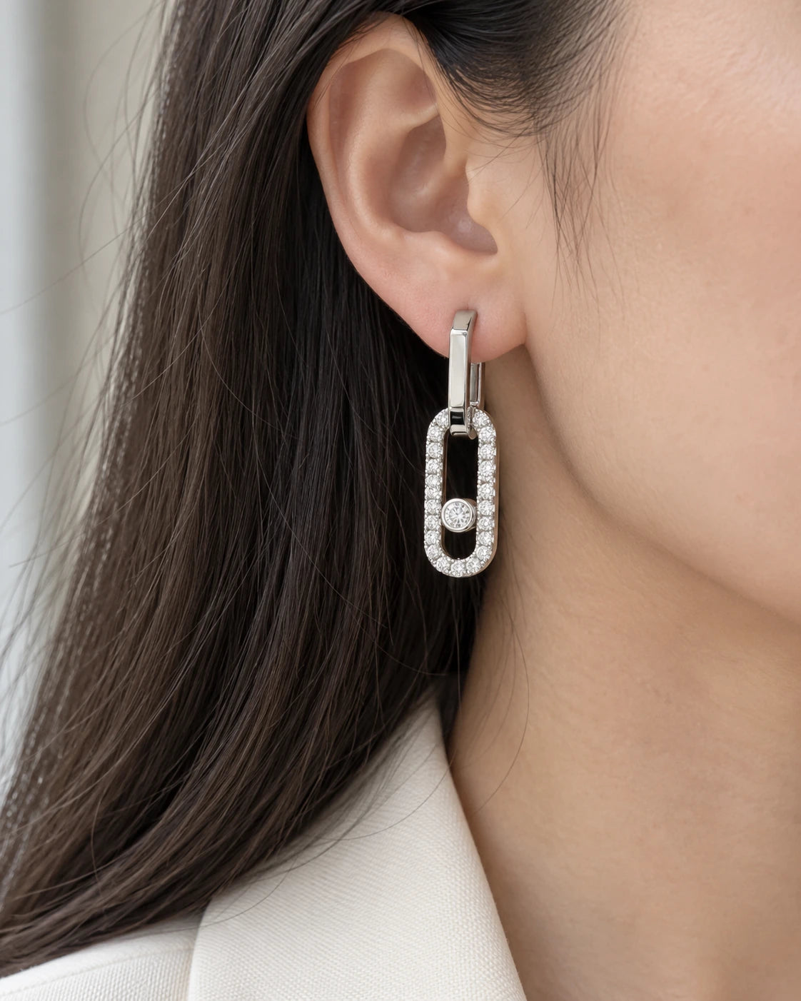 Pavé CZ Open Link Drop Earrings with Sliding Stone worn on an adult model