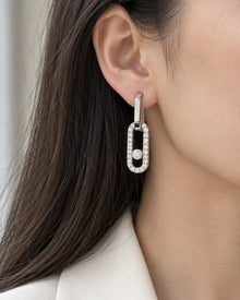 Pavé CZ Open Link Drop Earrings with Sliding Stone worn on an adult model