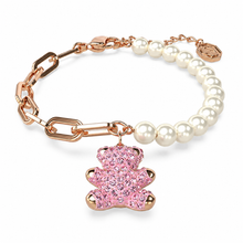Pink teddy charm bracelet with white pearl-style beads and rose-gold-tone links