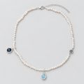 White Beaded Necklace with Blue Drop Charms