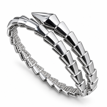 Serpent Aura silver-tone polished stone-free snake wrap bangle on white background